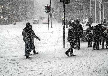 walking through snowy sidewalk without ice melting pellets
