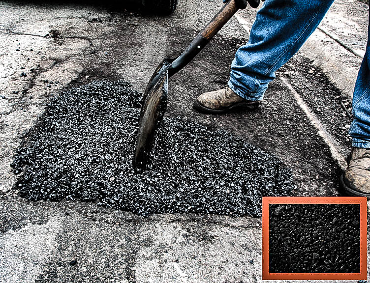 man performing asphalt repair in parking lot